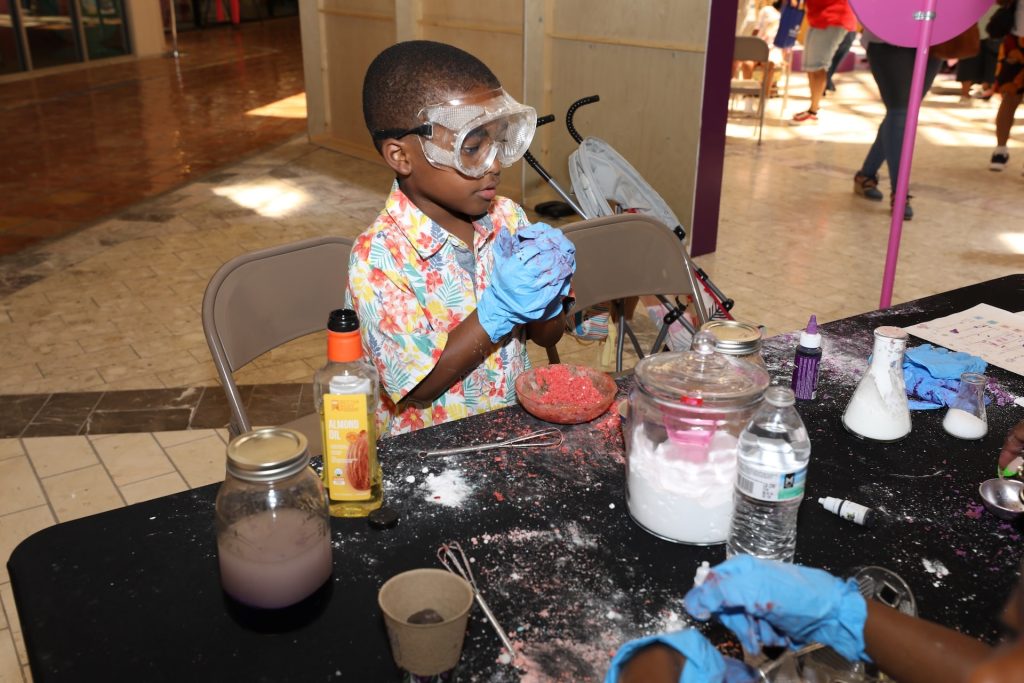 STEAM Academy - diverse child conducting science experiments